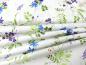 Preview: Patchworkstoff Clothworks aus der Serie Flowershop lila blau filigrane Blüten auf weiß Faltenwurf